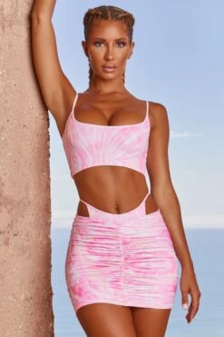 Imitation Thong Ruched Mini Skirt In Pink Tie Dye -Glam Dress Store 3304 1 island trip tie dye pink crop top ruched cut out strappy waist mini skirt two piece set
