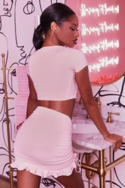 Ruched Bodycon Mini Skirt In Blush 16 Ruched Bodycon Mini Skirt In Blush -Glam Dress Store 3400 no ties 3409 here for the frill 8 blush front tie plunge crop top capped sleeve high waisted ruched frill skirt 3