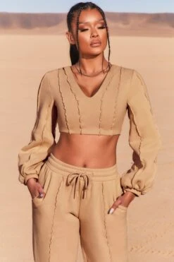Uncovered Exposed Seam Bardot Crop Top In Beige