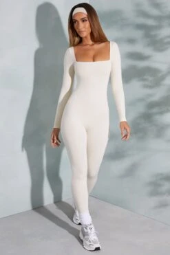 Square Neck Long Sleeve Jumpsuit In Ivory 15 Square Neck Long Sleeve Jumpsuit In Ivory -Glam Dress Store 3835 2 White Square Neck Jumpsuit fb03070b 1fba 4463 a5ad f19425853983
