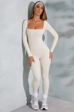 Square Neck Long Sleeve Jumpsuit In Ivory 17 Square Neck Long Sleeve Jumpsuit In Ivory -Glam Dress Store 3835 6 White Square Neck Jumpsuit 4c55f3fd b6b5 4398 9dfd 0682301d640b