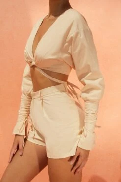 Pleated Shorts In Sand -Glam Dress Store 4160 4185 9 suite life buena vista sand balloon sleeve low neck crop top high waisted shorts 1