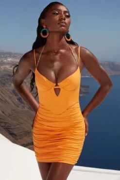 Ruched Corset Mini Dress In Orange -Glam Dress Store 4350 1 heating up orange bust flattering chain detailn mini dress