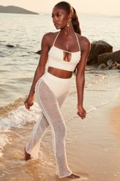 Beaded Crochet Crop Top In Ivory -Glam Dress Store 4370 5 sheer for you ivory pearl embelllished cut out crop top sheer beach trousers 1