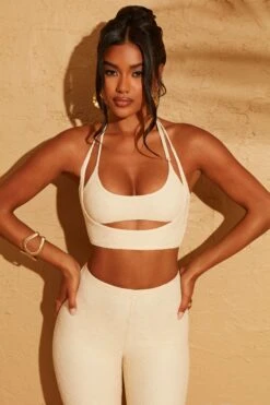 Double Layered Cut Out Crop Top In Cream 25 Double Layered Cut Out Crop Top In Cream -Glam Dress Store 5113 5095 11 Cream Double Layered Crop Top Lace Up Back Trousers