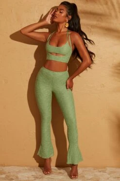 Double Layered Cut Out Crop Top In Green 34 Double Layered Cut Out Crop Top In Green -Glam Dress Store 5113 5095 14 Cream Double Layered Crop Top Lace Up Back Trousers