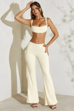 Twist Strap Cut Out Flare Trousers In Ivory -Glam Dress Store 5148 1 Callie Ivory Twost Cut Out Flare Trousers 547f2adc 635f 4f8b bbe5 e2854663411a