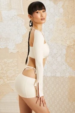 Side Tie Mini Skirt In Ivory 11 Side Tie Mini Skirt In Ivory -Glam Dress Store 5209 5152 7 Flora Jardin Ivory Drawstring Bust Ruched Crop Top Side Tie Mini Skirt