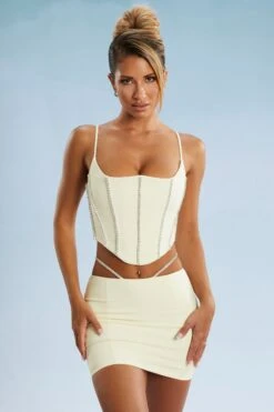 Embellished Cut Out Mini Skirt In Ivory -Glam Dress Store 5388 5384 1 Ivory Embellished Cut Straps Mini Skirt Corset Top b9ed0b07 5d93 45e5 b8e5 1cf28ff2c8c8