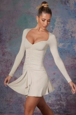 Long Sleeve Waterfall Skirt Mini Dress In Stone -Glam Dress Store 5473 8 Lili Stone Long Sleeve Halter Neck Mini Dress With Waterfall Skirt