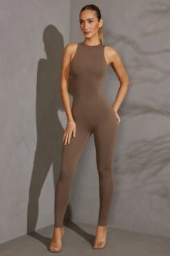 Racer Neck Jumpsuit In Taupe -Glam Dress Store 5610 1 Vida Charcoal Racer Neck Romper 0c2f2f2e 4dbe 43df 9891 610cc1f8e235