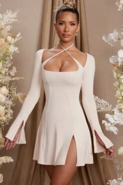 Long Sleeve Cross Over Strap Mini Dress In Cream -Glam Dress Store 5835 6 Salome Cream Cross Over Strap Split Mini Dress