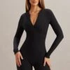Long Sleeve Romper In Black 1 Long Sleeve Romper In Black -Glam Dress Store 5874 1 Ciji Black Zip Up Romper 17fd29bd a8b7 4900 bf93 880182df58be