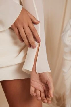 Long Sleeve Draped Mini Dress In Ivory 14 Long Sleeve Draped Mini Dress In Ivory -Glam Dress Store 6185 6 Mila Ivory Long Sleeve Cowl Neck Draped Mini Dress