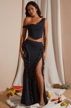 Mid Rise Ruffle Detail Maxi Skirt In Black 28 Mid Rise Ruffle Detail Maxi Skirt In Black -Glam Dress Store 6912 6920 1 Black Draped Corset Top Midrise Ruffle Gown Skirt acf21b90 61cd 4fb5 a37c 0ae891a7e4c2
