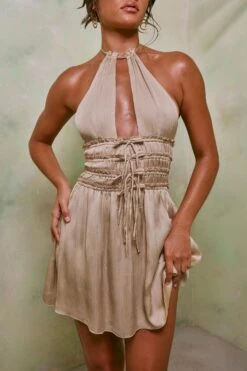 Halter Neck Cut Out Shirred Mini Dress In Sand -Glam Dress Store 7191 4 Tulia Sand Crinkle Tie Up Halterneck Shirring Mini Dress