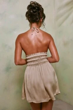 Halter Neck Cut Out Shirred Mini Dress In Sand -Glam Dress Store 7191 6 Tulia Sand Crinkle Tie Up Halterneck Shirring Mini Dress