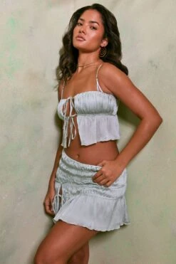 Shirred Tie Up Front Crop Top In Pastel Green 23 Shirred Tie Up Front Crop Top In Pastel Green -Glam Dress Store 7195 7206 5 Pastel Green Tie Up Front Crop Top Crinkle Tie Up Asymmetrical Shirring Mini Skirt e57dff61 8c9f 4712 8306 9668d79f80ac