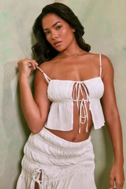 Shirred Thigh High Split Mid Rise Mini Skirt In White -Glam Dress Store 7195 7206 6 White Tie Up Front Crop Top Crinkle Tie Up Asymmetrical Shirring Mini Skirt 500972ed f870 4412 b457 53a7e992d1be