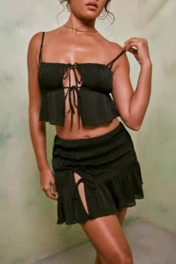 Shirred Thigh High Split Mid Rise Mini Skirt In Black -Glam Dress Store 7195 7206 9 Dina Arlet Black Tie Up Front Top Crinkle Tie Up Asymmentical Mini a5ddfdaf 37c5 47f3 aebe 449eac9a24c7