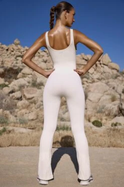 Flared Full Length Unitard In Bone -Glam Dress Store BT0721 5 Powerfull Ivory Flared One Piece Jumpsuit 1 616bca66 36e9 4fd0 b5f4 9db8e3f64285
